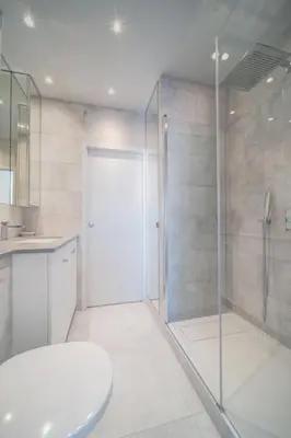a bathroom with a shower and a glass door at REF 774 - Cannes Old Port - Sea view partment for rent in Cannes
