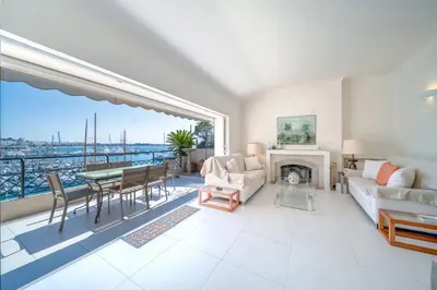 a living room with a view of the water at REF 774 - Cannes Old Port - Sea view partment for rent in Cannes