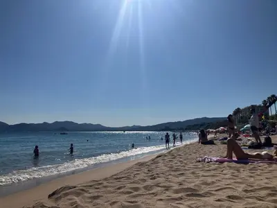 a group of people laying on the beach at Studio à Cannes quartier du Suquet in Cannes