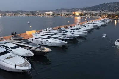 a row of boats docked in a harbor at PALME Yacht - Cannes Port Canto - Pointe Croisette - Face à la Mer in Cannes