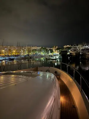 a boat docked in a marina at night at PALME Yacht - Cannes Port Canto - Pointe Croisette - Face à la Mer in Cannes