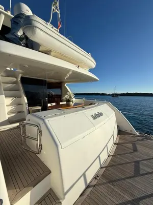 a white boat on the water with a dock at PALME Yacht - Cannes Port Canto - Pointe Croisette - Face à la Mer in Cannes