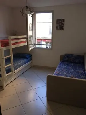 a bedroom with two bunk beds and a window at Le Carre Montfleury Cannes in Cannes