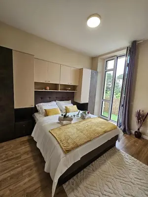a bedroom with a large bed with a large window at Central Cannes Cozy T4 Walk to Beach & Congress in Cannes