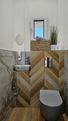 a bathroom with a toilet and a sink at Central Cannes Cozy T4 Walk to Beach & Congress in Cannes