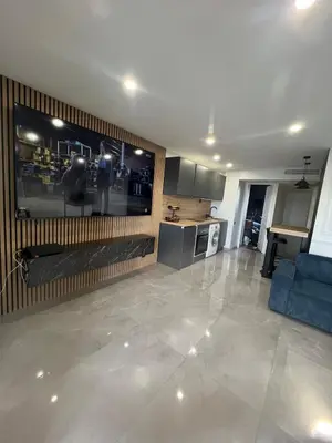 a living room with a large flat screen tv at Apartment Cannes sea view! in Cannes
