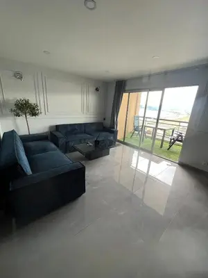 a living room with a couch and a large window at Apartment Cannes sea view! in Cannes