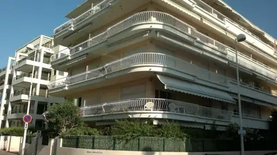 a large building with balconies on the side of it at Charming & Elegant La Croisette apartment in Cannes in Cannes