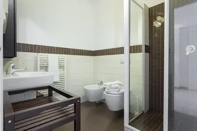 a bathroom with a toilet and a sink and a shower at Charming & Elegant La Croisette apartment in Cannes in Cannes