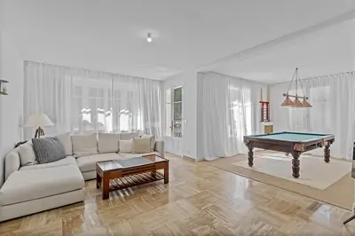 a living room with a couch and a pool table at REF 2177- Exceptional Villa in the Heart of Cannes 5mins from La Croisette in Cannes