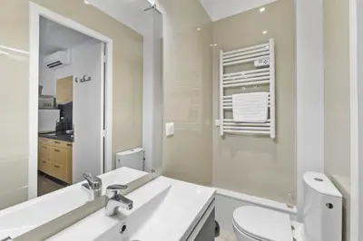 a bathroom with a sink and a toilet and a mirror at Centre Cannes - 1 Chambre - Proche Palais - Calme in Cannes