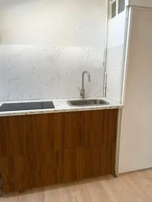 a kitchen with a sink and a counter top at Chic studio Palais 2 min away in Cannes