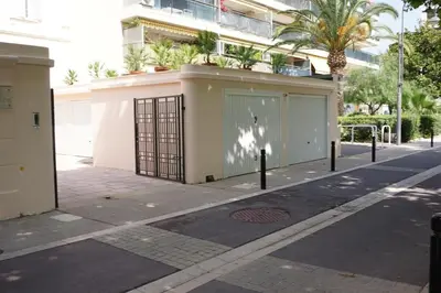 a building with a gate on the side of a street at Studio La Croisette Cannes La Croix d'Or 2 in Cannes