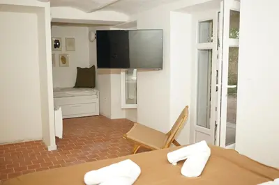 a room with a table and a flat screen tv at Studio La Croisette Cannes La Croix d'Or 2 in Cannes