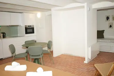 a kitchen and dining room with a table and chairs at Studio La Croisette Cannes La Croix d'Or 2 in Cannes