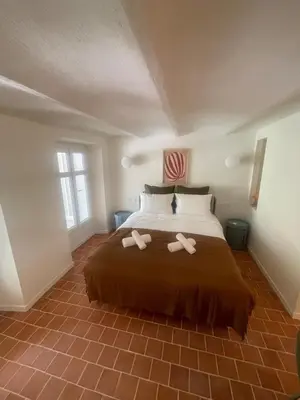 a bedroom with a bed with two slippers on it at Studio La Croisette Cannes La Croix d'Or 2 in Cannes