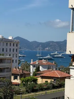 a view of a city with boats in the water at Square Croisette in Cannes
