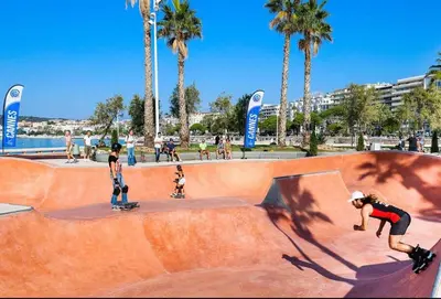 a group of people on skateboards at a skate park at Square Croisette in Cannes