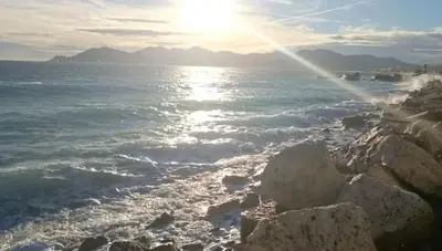 a view of the ocean from a rocky shoreline at Appartement 4 personnes à 500 mètres des plages de sable in Cannes
