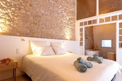 a bedroom with a bed with towels on it at Lux PH Gem 3BR 200m palais and beach in Cannes
