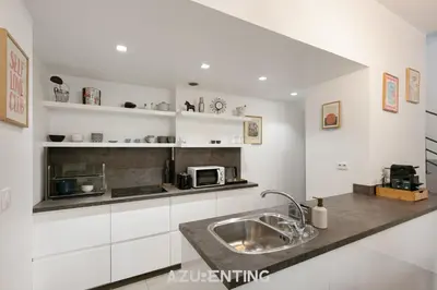 a kitchen with a sink and a microwave at Azurenting - Maison Césario - 3 chambres in Cannes