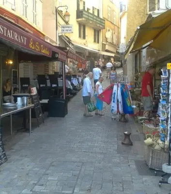 a group of people standing in a street market at PROMO! Studio, Plein Center, Vieux Port, 200 m des plages in Cannes