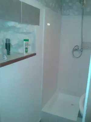 a white bathroom with a shower and a sink at PROMO! Studio, Plein Center, Vieux Port, 200 m des plages in Cannes