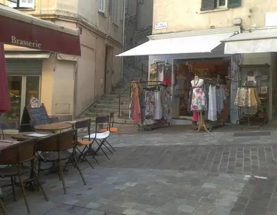 an empty street with tables and chairs in front of a store at PROMO! Studio, Plein Center, Vieux Port, 200 m des plages in Cannes