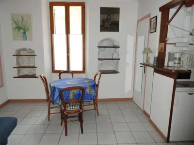 a kitchen with a table with a blue table cloth on it at PROMO! Studio, Plein Center, Vieux Port, 200 m des plages in Cannes