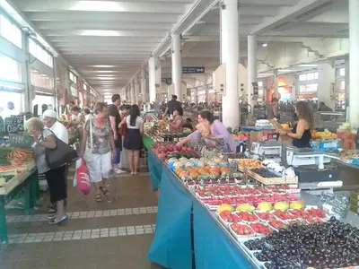 a group of people in a market with fruits and vegetables at PROMO! Studio, Plein Center, Vieux Port, 200 m des plages in Cannes