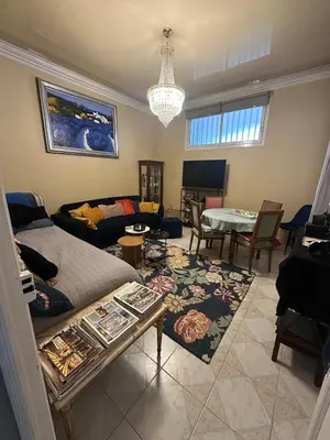 a living room with a couch and a table at T3 Cannes Banane in Cannes