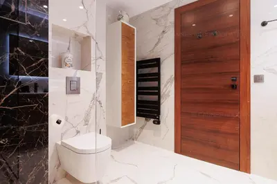 a bedroom with a white bed and a red chair at GRAY 3e1 in Cannes