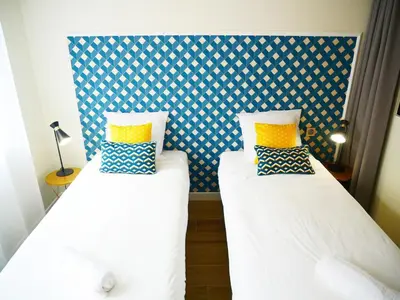 two beds sitting next to each other in a room at Sublime apartment 100 m from the Croisette in Cannes