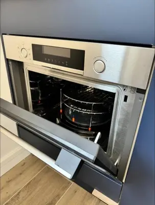 a microwave oven with its door open in a kitchen at Studios Cannes Les 3 éléments in Cannes