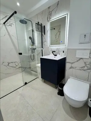 a bathroom with a shower and a toilet and a sink at Studios Cannes Les 3 éléments in Cannes