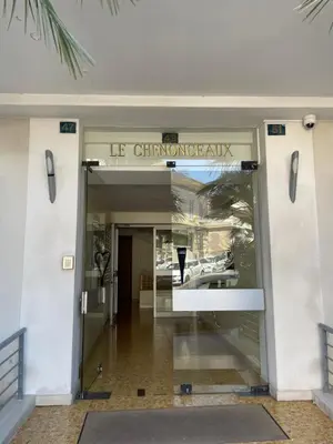 an entrance to a store with a glass door at 2 pièces vue sur le Suquet in Cannes