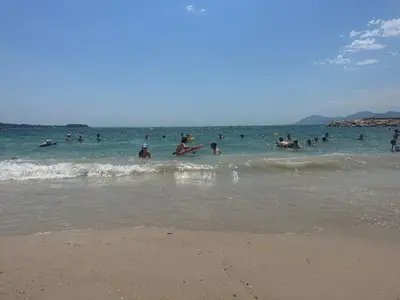 a group of people in the water at the beach at Rooftop La Croisette Cannes in Cannes