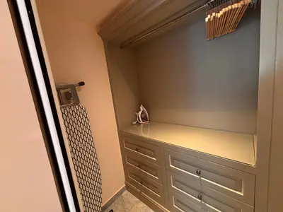 a walk in closet with a dresser in a room at Appart exceptionnel terrasse mer in Cannes