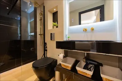 a bedroom with a large white bed and a television at Hôtel particulier Marceau - Centre - Neuf - Suites de 3 à 28 chambres in Cannes