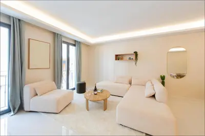 a kitchen with a black counter top and appliances at Hôtel particulier Marceau - Centre - Neuf - Suites de 3 à 28 chambres in Cannes
