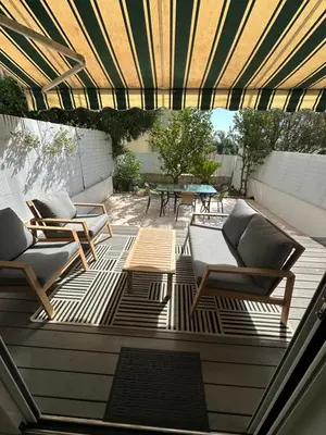 a patio with two chairs and a table at Appartement terrasse Cannes Suquet proche plage et centre in Cannes