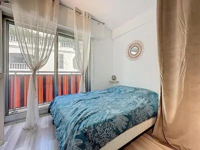 a bedroom with a bed and a window at Rivieira - By Coco in Cannes