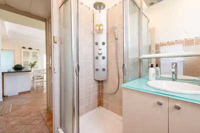a bathroom with a shower and a sink at 140m Villa with Pool Near Cannes in Le Cannet