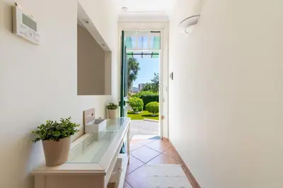a hallway with a door leading to a yard at 140m Villa with Pool Near Cannes in Le Cannet