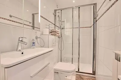 a bathroom with a shower and a toilet and a sink at Studio lumineux avec parking - Gare & Palais à pied in Cannes