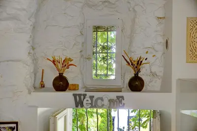 three vases sitting on a shelf with a window at Sandra - Atypical and Charming - Suquet - VCA in Cannes