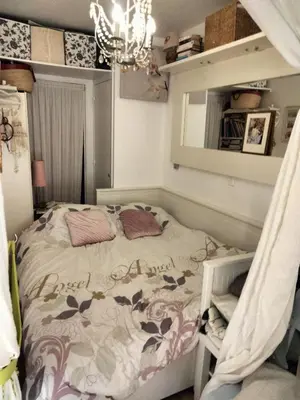 a bedroom with a bed and a mirror and a chandelier at Near Croisette atypic studio garden pool in Cannes