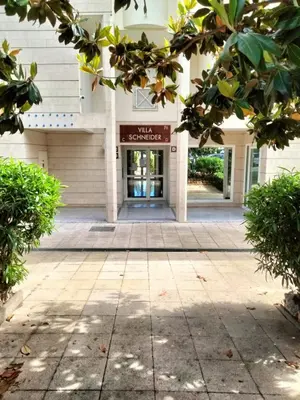 an entrance to a building with trees in the foreground at Near Croisette atypic studio garden pool in Cannes