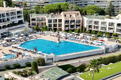 an overhead view of a large swimming pool in a resort at Vue Mer Azur - Villa France Cannes in Cannes