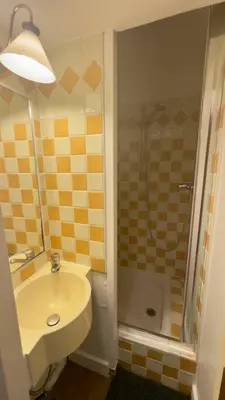 a bathroom with a sink and a shower at Vue Mer Azur - Villa France Cannes in Cannes